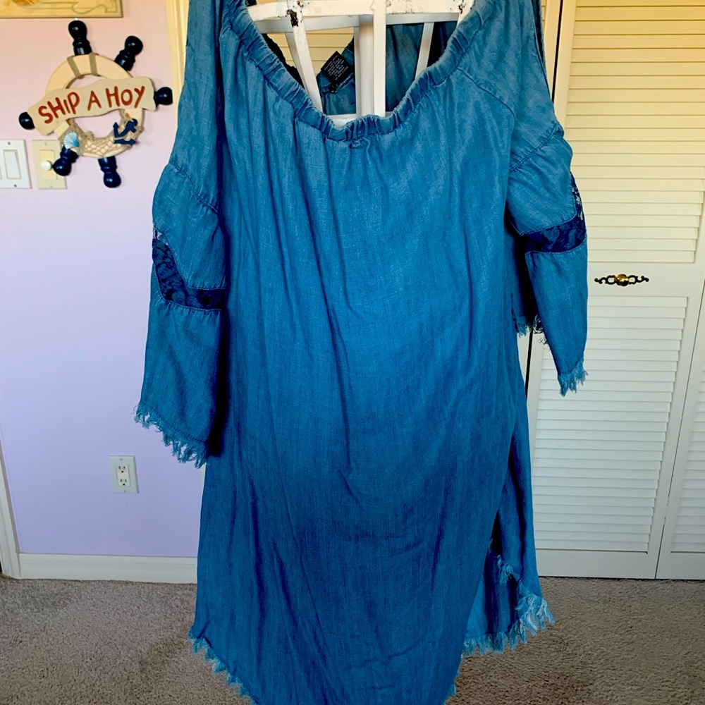 A find peasant blue Jean dress with open sleeves and buttons up the back
